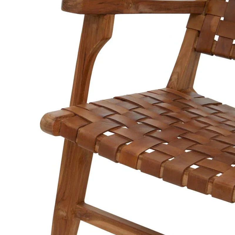 Close-up of wooden armchair with woven leather seat and backrest