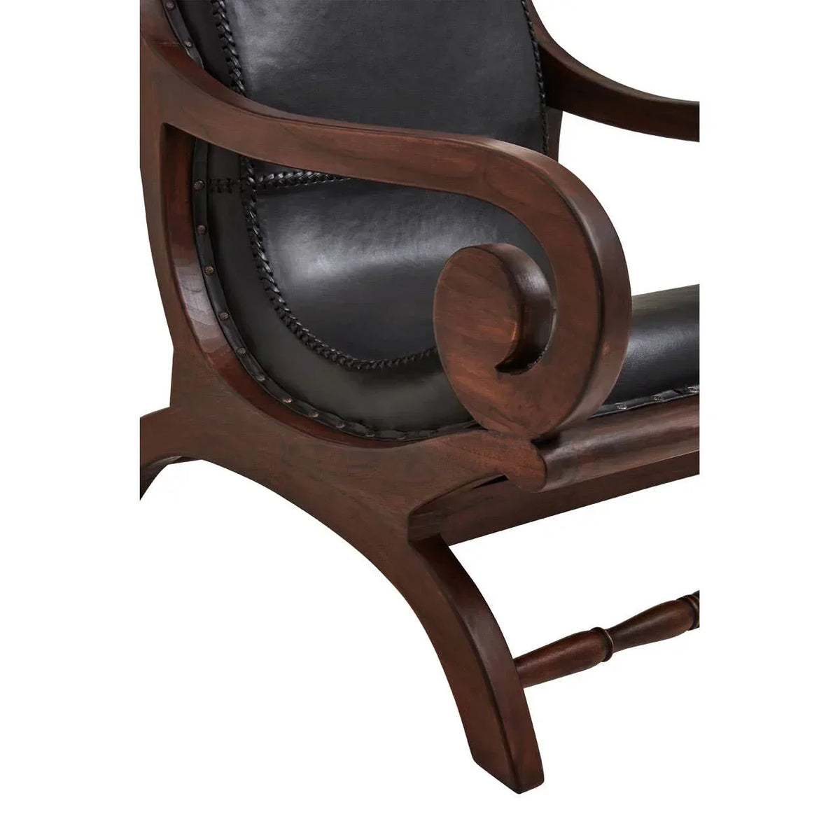Close view of wooden accent chair with black leather seat and curved armrest detail