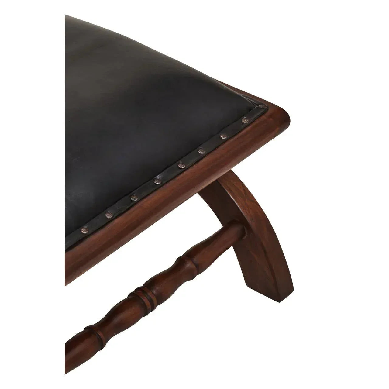 Black leather wooden bench corner with studded trim and turned wood leg detail