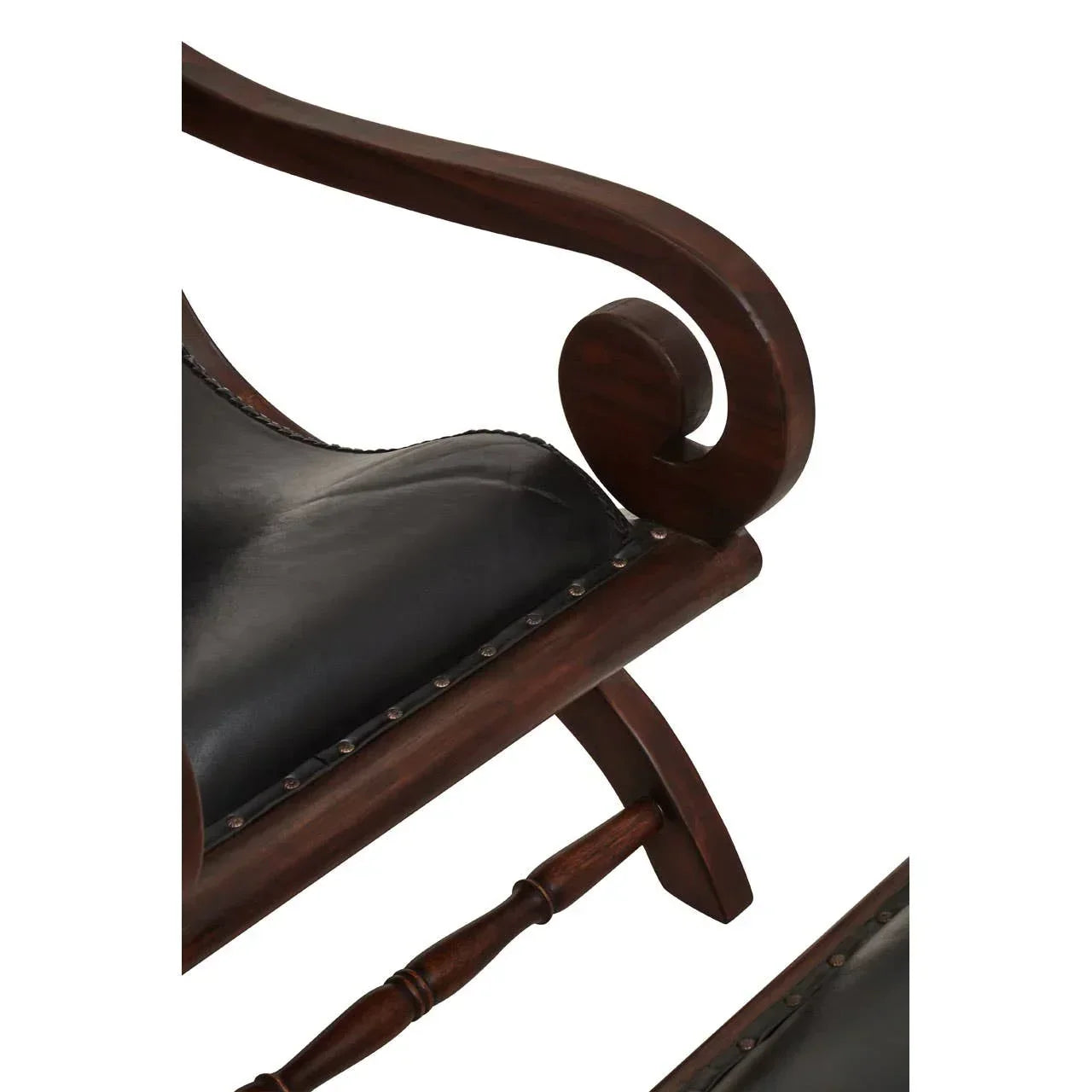 Detailed view of wooden armchair with black leather seat and curved armrest