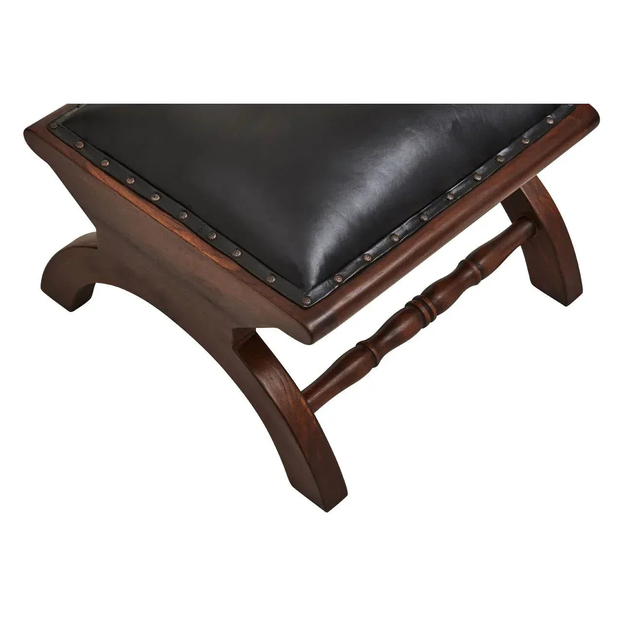Wooden stool with black leather seat and studded edge, shown at an angle