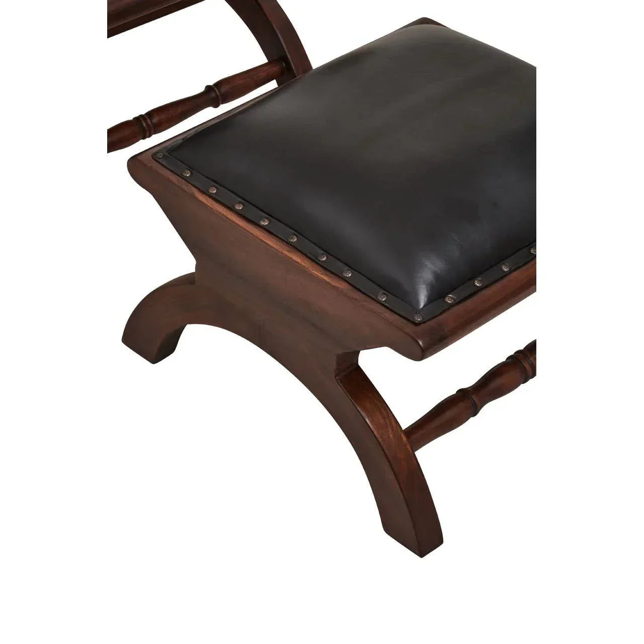 Dark wood dining chair with black leather seat and decorative stud detailing, close-up view
