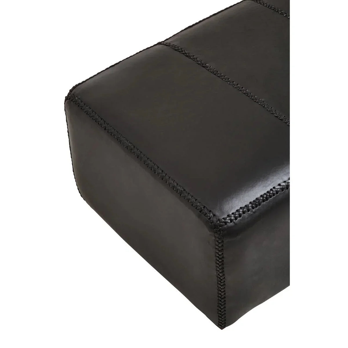 Corner view of black leather ottoman with visible stitched seams
