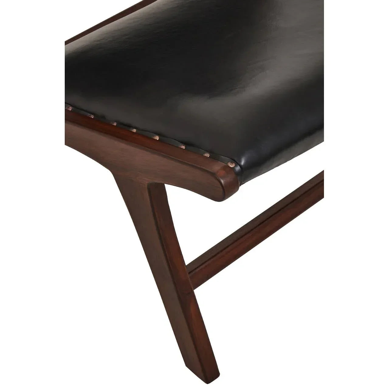 Close-up of wooden dining bench with black leather seat and visible metal stud detailing