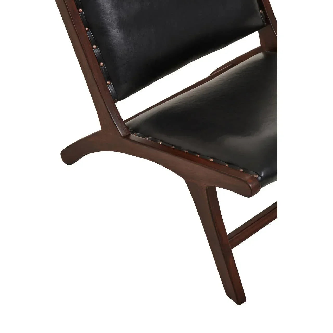 Closeup of black leather chair seat with dark wood frame and visible stud details