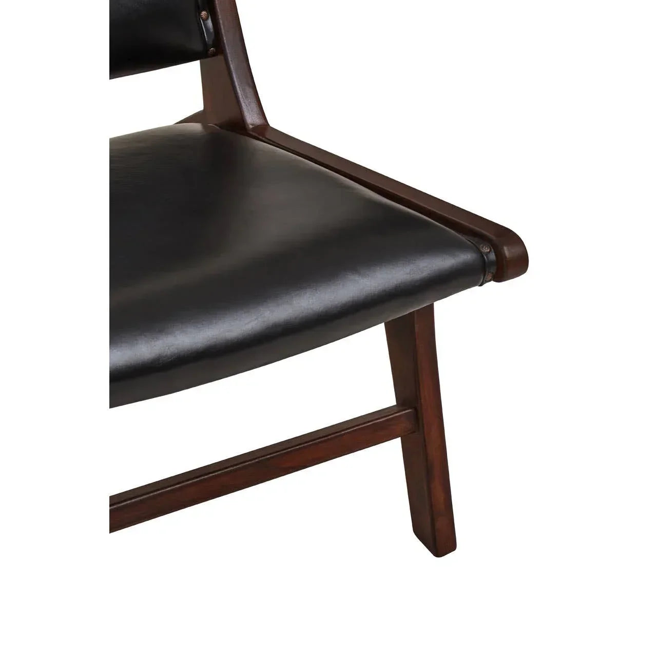 Closeup of wooden dining chair with black leather seat and cushioned backrest