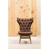 Brown leather effect chair featuring a winged back design with tufted detailing. The chair is supported by light wooden legs, providing a modern yet classic aesthetic.