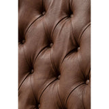 Close-up of the tufted brown leather effect upholstery on a chair, showcasing the rich texture and detailed stitching, with a soft, inviting appearance.