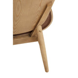 Brown leather effect chair featuring a winged back design, with a smooth elm wood frame and tapered legs.
