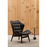 Stylish black leather effect chair featuring a tufted design and a curved backrest, supported by sleek wooden legs.