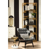 Stylish black leather effect chair featuring a tufted design and a sleek silhouette, complemented by a decorative black and white patterned cushion.