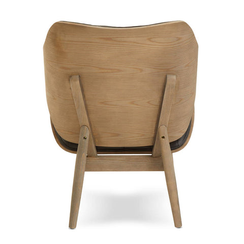 Stylish black leather effect chair featuring a curved backrest with button detailing, supported by light elm wood legs.