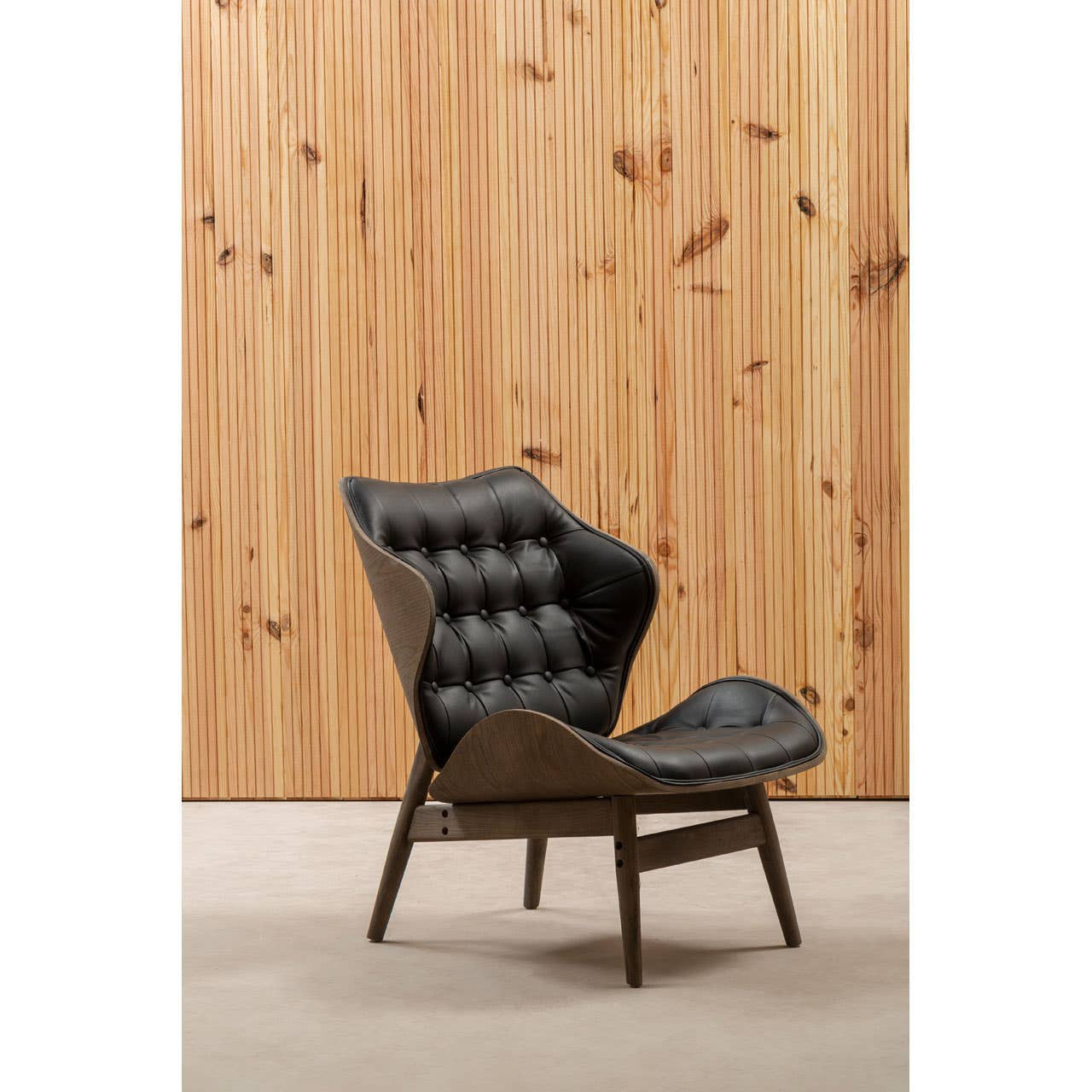 Stylish black leather effect chair featuring a tufted button detail on the backrest, complemented by a sleek elm wood frame.