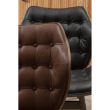 Black leather effect chair featuring button detailing, with a contrasting brown leather effect chair partially visible in the foreground.