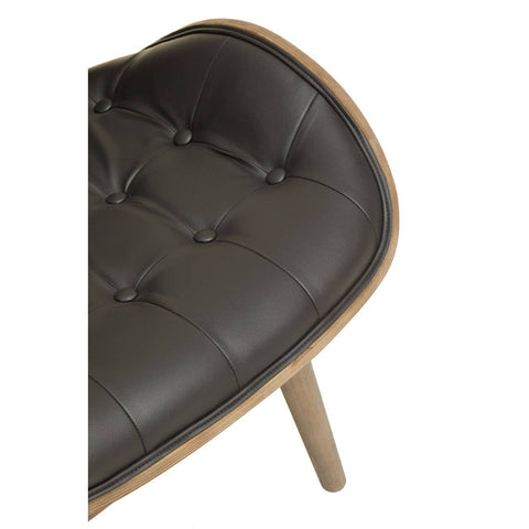Stylish black leather effect chair featuring a tufted design with button detailing, complemented by a natural wood frame and tapered legs.