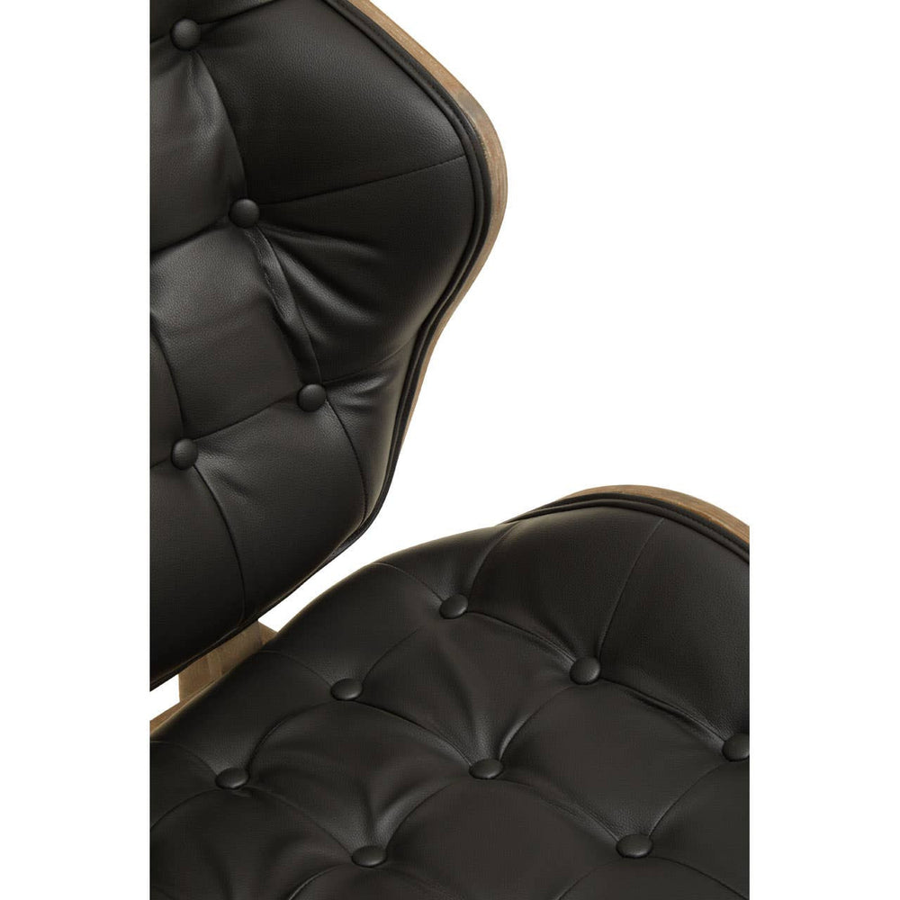 Stylish black leather effect chair featuring a tufted design with button detailing, showcasing a sleek silhouette and a warm elm wood frame.