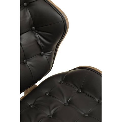 Stylish black leather effect chair featuring a tufted design with button detailing, showcasing a sleek silhouette and a warm elm wood frame.
