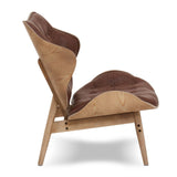 Brown leather effect chair featuring a curved design with tufted upholstery and a natural wood frame.