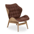 Stylish brown leather effect chair featuring a tufted backrest and seat, complemented by a natural wood frame.