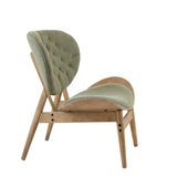 Green velvet chair featuring a tufted backrest and a sleek, curved seat, supported by a light grey elm wood frame with angled legs.
