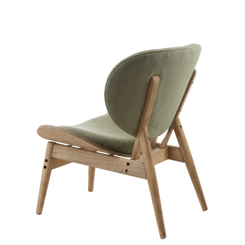 Green velvet chair featuring a rounded backrest and a sleek, minimalist design.
