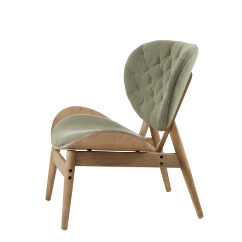 Green velvet chair featuring a tufted backrest and a sleek, curved seat, supported by a light grey elm wood frame with angled legs.