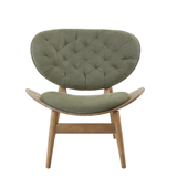 Green velvet chair featuring a tufted backrest and a curved seat, supported by a grey elm wood frame with tapered legs.