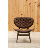 Brown velvet chair featuring a tufted backrest and a wide seat, supported by a dark elm wood frame with a minimalist design.