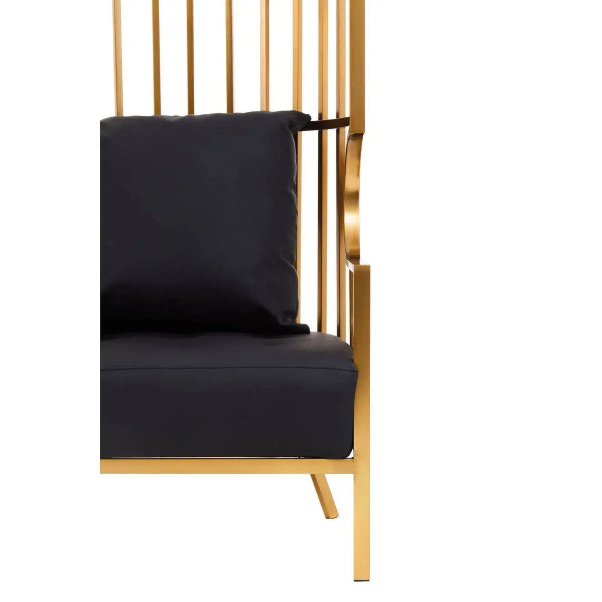 Gold armchair with vertical metal slats and black seat cushion, corner detail view