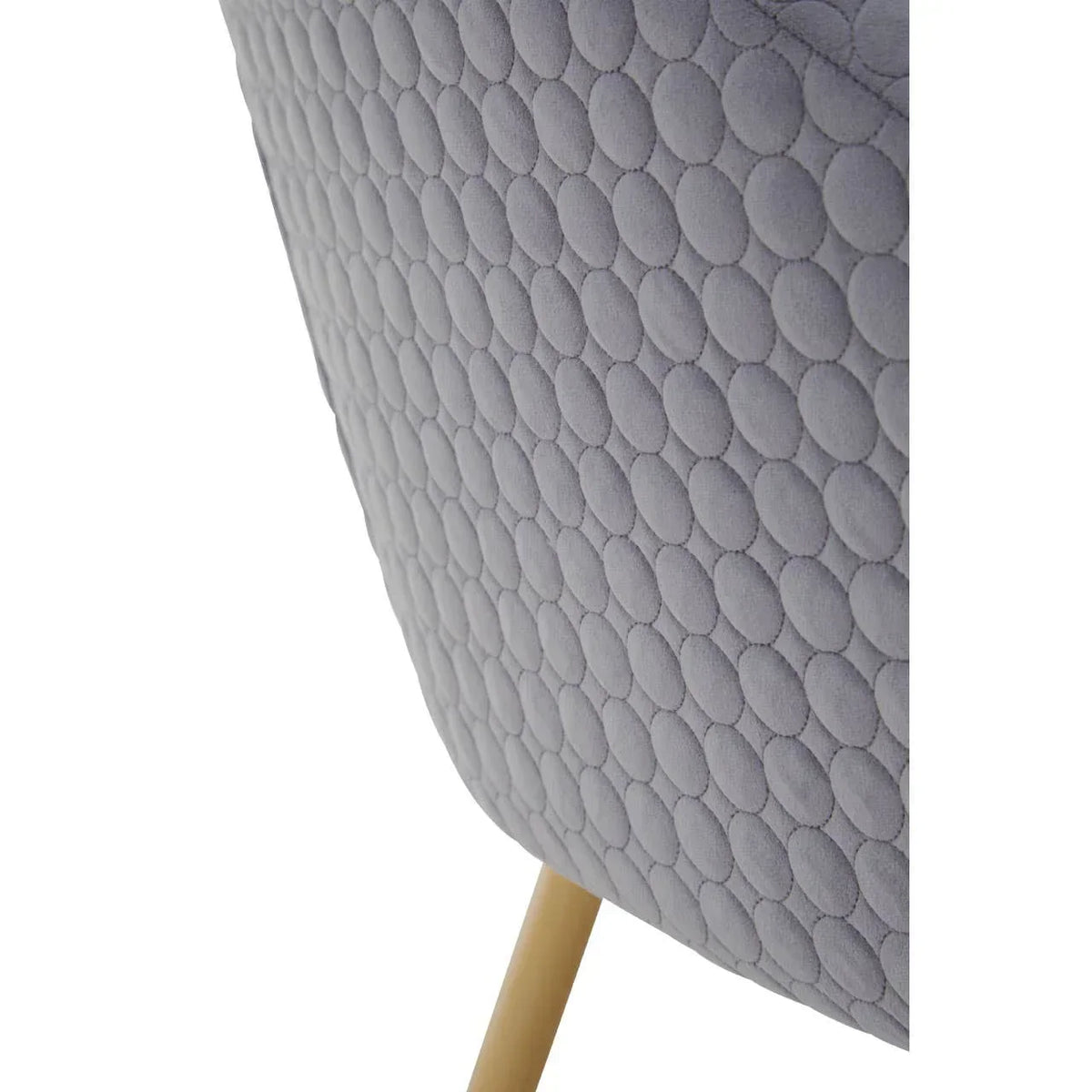Grey fabric armchair with textured circular upholstery and wooden leg