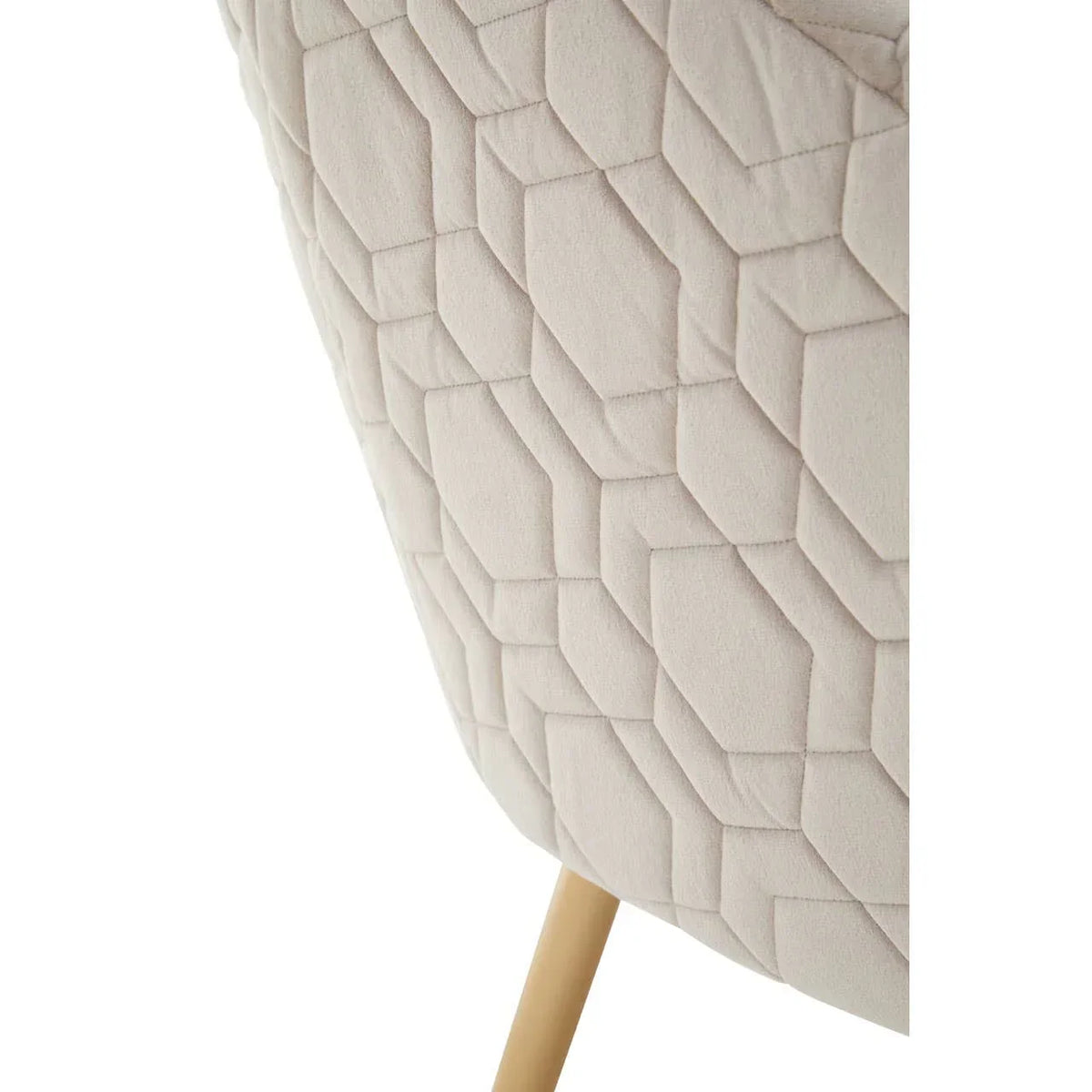Beige quilted fabric chair with geometric pattern and natural wood leg close-up