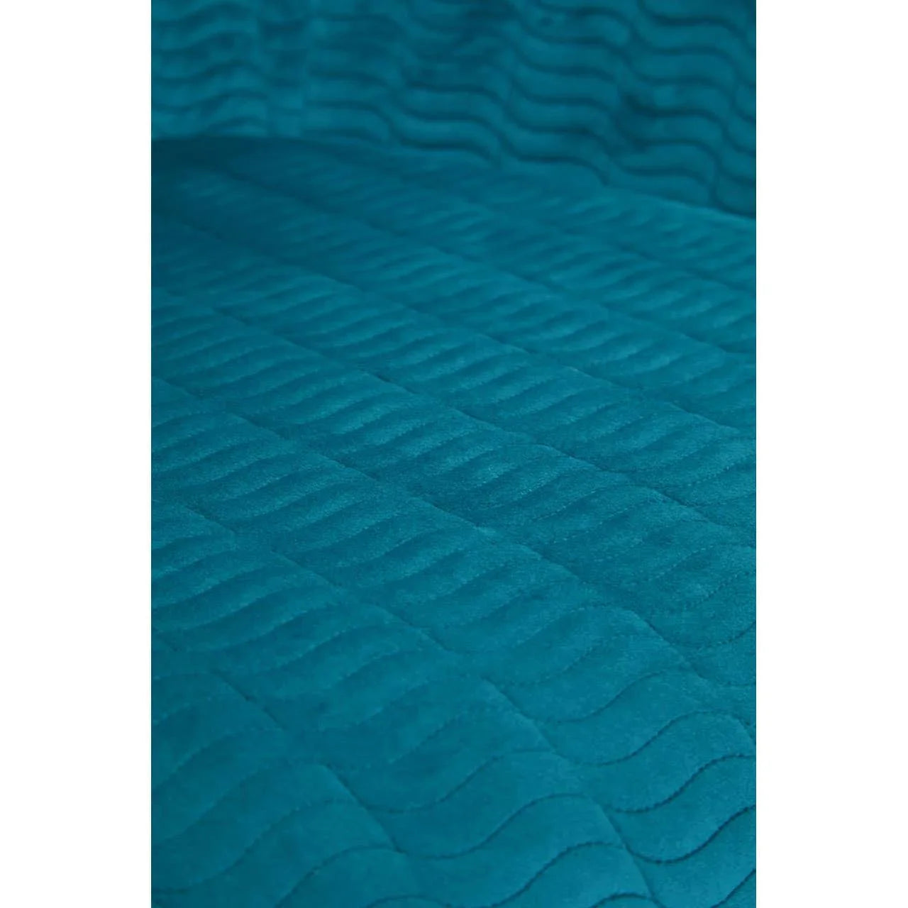 Teal quilted fabric upholstery with wave stitching, close-up view