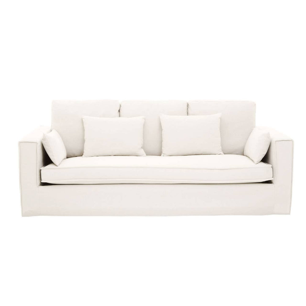 Cream-colored three-seat sofa featuring a modern design with plush cushions and three matching throw pillows. The sofa has a clean, minimalist silhouette and is upholstered in a soft fabric, making it suitable for various interior styles