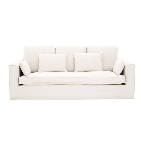 Cream-colored three-seat sofa featuring a modern design with plush cushions and three matching throw pillows. The sofa has a clean, minimalist silhouette and is upholstered in a soft fabric, making it suitable for various interior styles