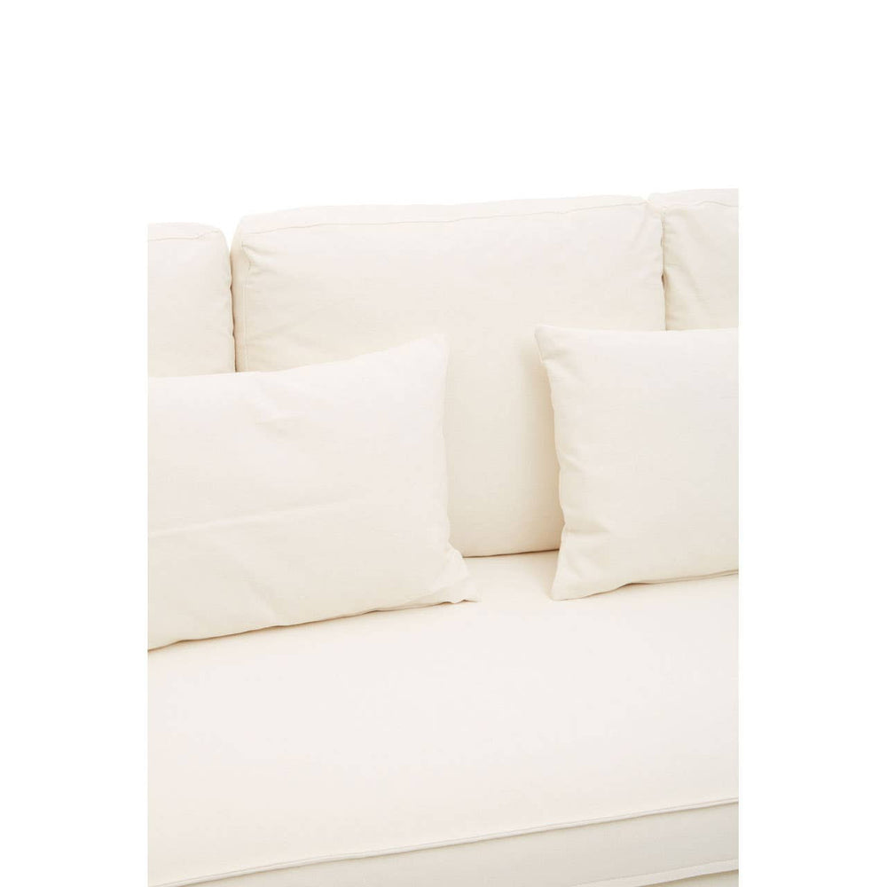 Cream-colored three-seat sofa with plush cushions and a smooth fabric finish, featuring two large back cushions and two smaller decorative pillows. The sofa has a modern design and a clean, minimalist aesthetic