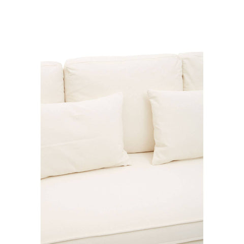 Cream-colored three-seat sofa with plush cushions and a smooth fabric finish, featuring two large back cushions and two smaller decorative pillows. The sofa has a modern design and a clean, minimalist aesthetic