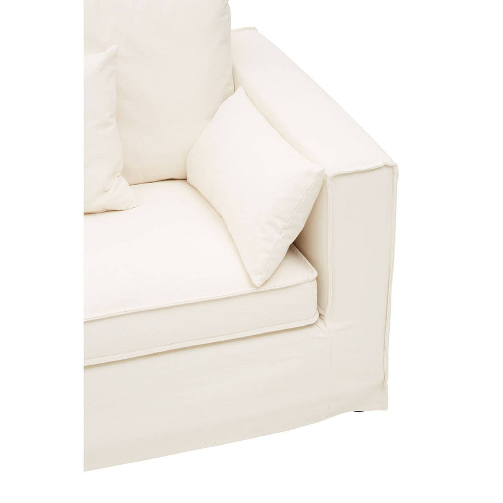 Cream-colored three-seat sofa with a modern design, featuring plush cushions and clean lines. The armrest is square and sturdy, complementing the overall minimalist aesthetic