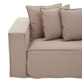 A grey three-seat sofa with a modern design, featuring a low-profile armrest and several plush cushions in varying sizes arranged on the backrest. The fabric has a soft texture, and the overall look is contemporary and inviting
