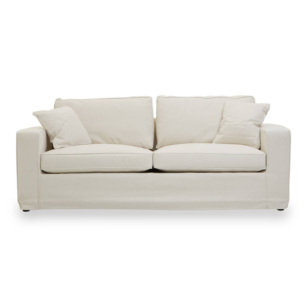 Cream fabric sofa with a modern design featuring two large seat cushions and two smaller accent pillows, resting on short, sturdy legs. The sofa has a clean, minimalist silhouette and is upholstered in a soft, textured fabric