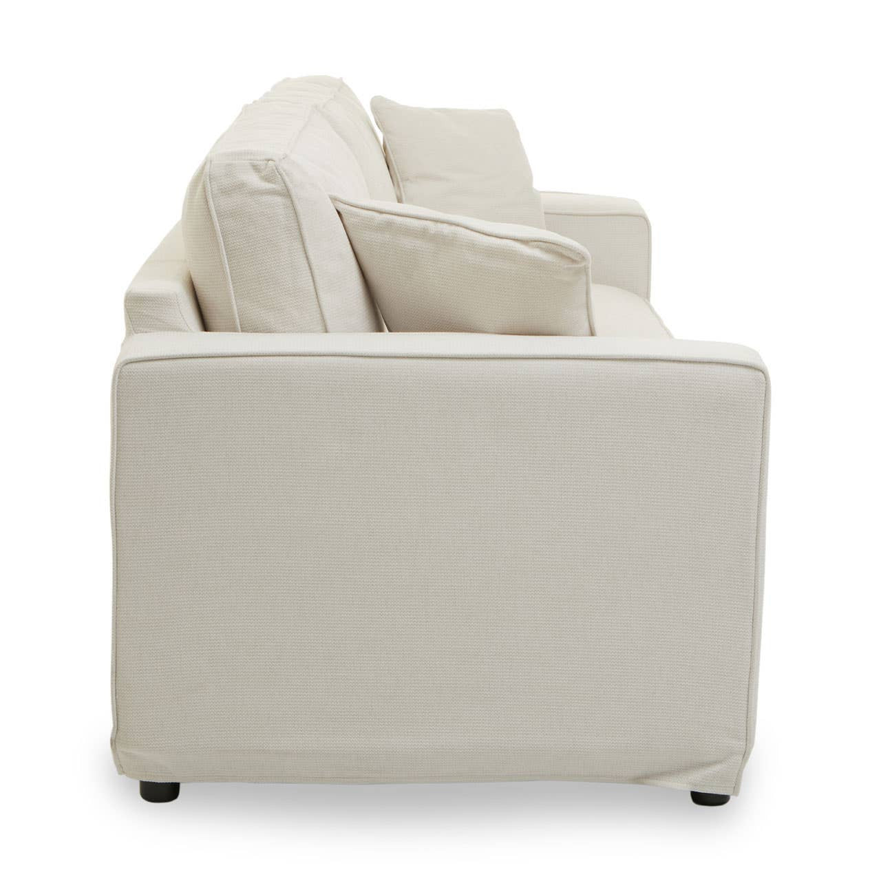 Cream fabric sofa with three seats, featuring a clean, modern design and plush cushions. The sofa has a low back and rounded edges, resting on small, dark legs