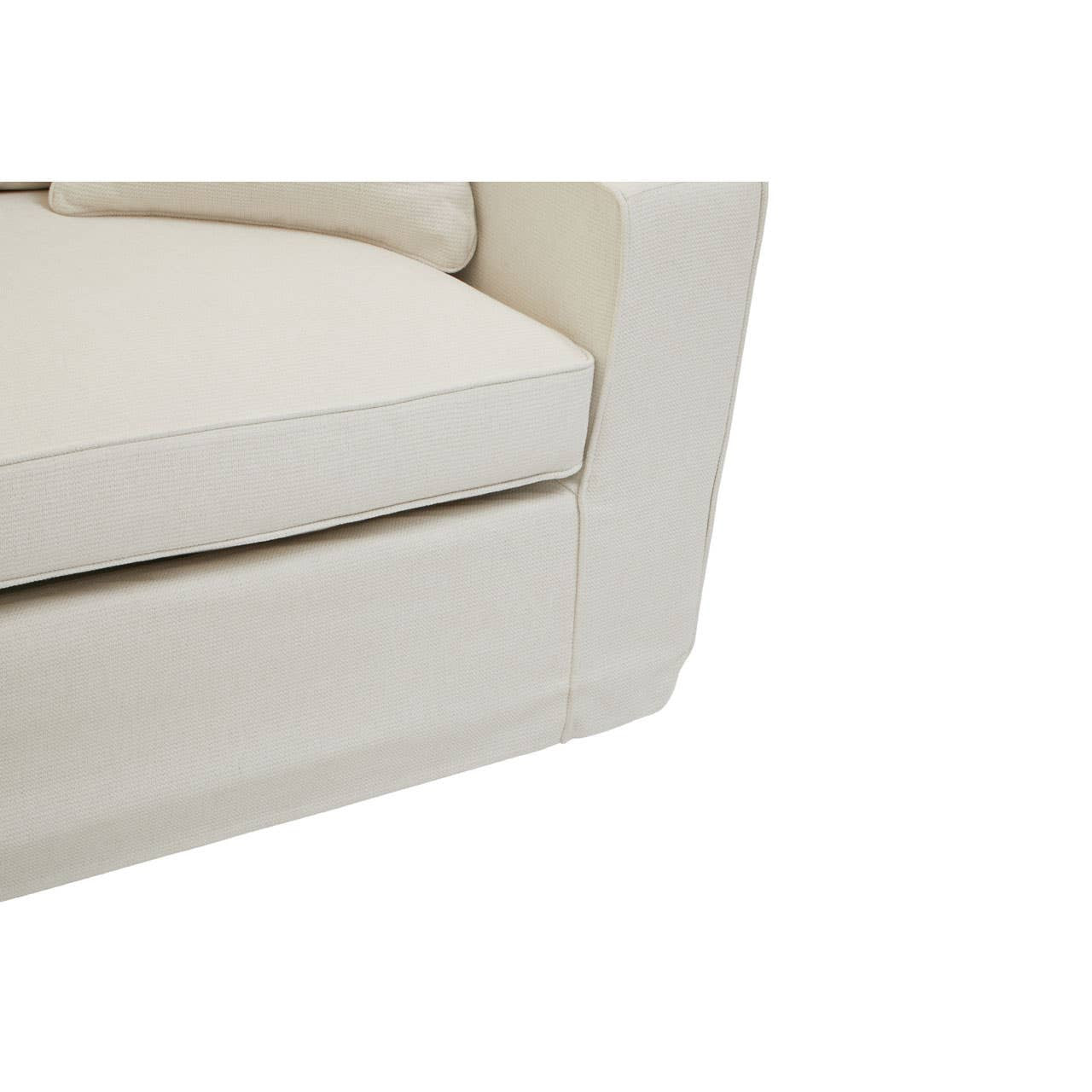 Cream fabric sofa with a modern design, featuring a plush seat cushion and clean lines. The corner of the sofa is visible, showcasing its smooth edges and sturdy construction