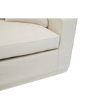Cream fabric sofa with a modern design, featuring a plush seat cushion and clean lines. The corner of the sofa is visible, showcasing its smooth edges and sturdy construction