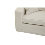 Cream fabric sofa with a modern design, featuring a low-profile armrest and plush cushions. The seat cushion is slightly recessed, and the overall look is minimalist and inviting, suitable for contemporary home decor