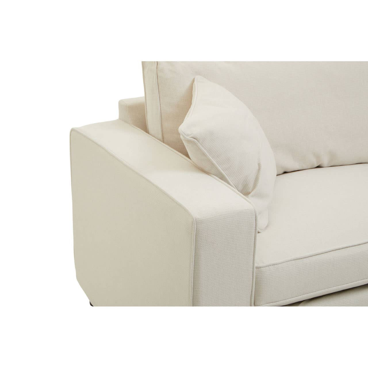 Cream fabric sofa with a modern design featuring a wide armrest and a plush back cushion. The upholstery appears soft and inviting, complemented by a matching throw pillow. The overall look is clean and contemporary, suitable for various home decor styles