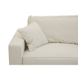Cream fabric sofa with a modern design featuring a wide armrest and a plush seat cushion. A decorative pillow is placed on the sofa, enhancing its comfort and style. The overall look is minimalist and inviting, suitable for various interior decor styles