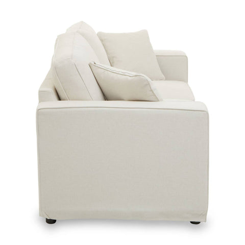 Cream fabric two-seat sofa with a minimalist design, featuring plush back cushions and square armrests. The sofa is supported by short, dark legs, and the overall look is modern and inviting