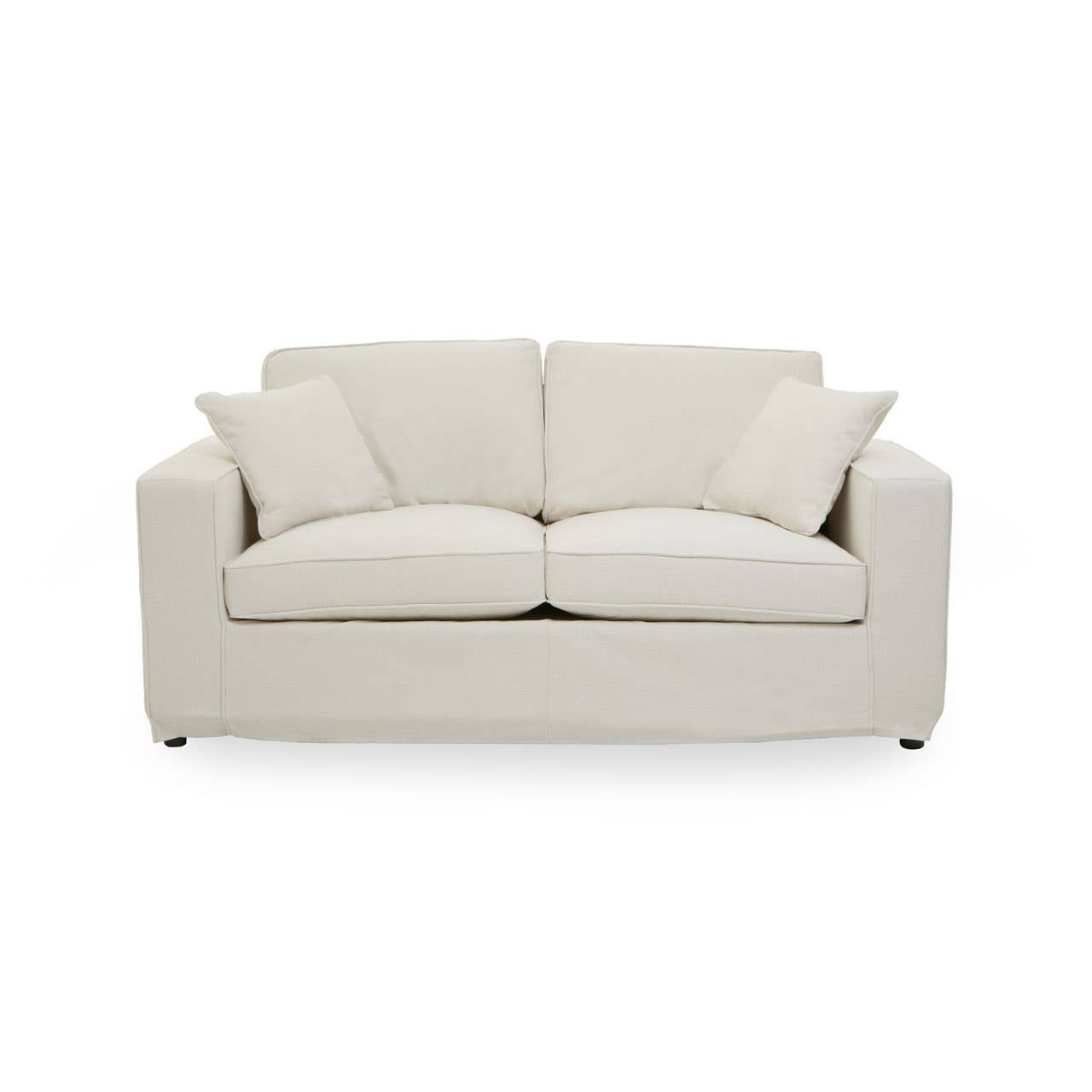 Cream fabric two-seat sofa with a modern design, featuring two plush back cushions and two matching throw pillows, resting on short wooden legs