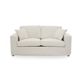 Cream fabric two-seat sofa with a modern design, featuring two plush back cushions and two matching throw pillows, resting on short wooden legs