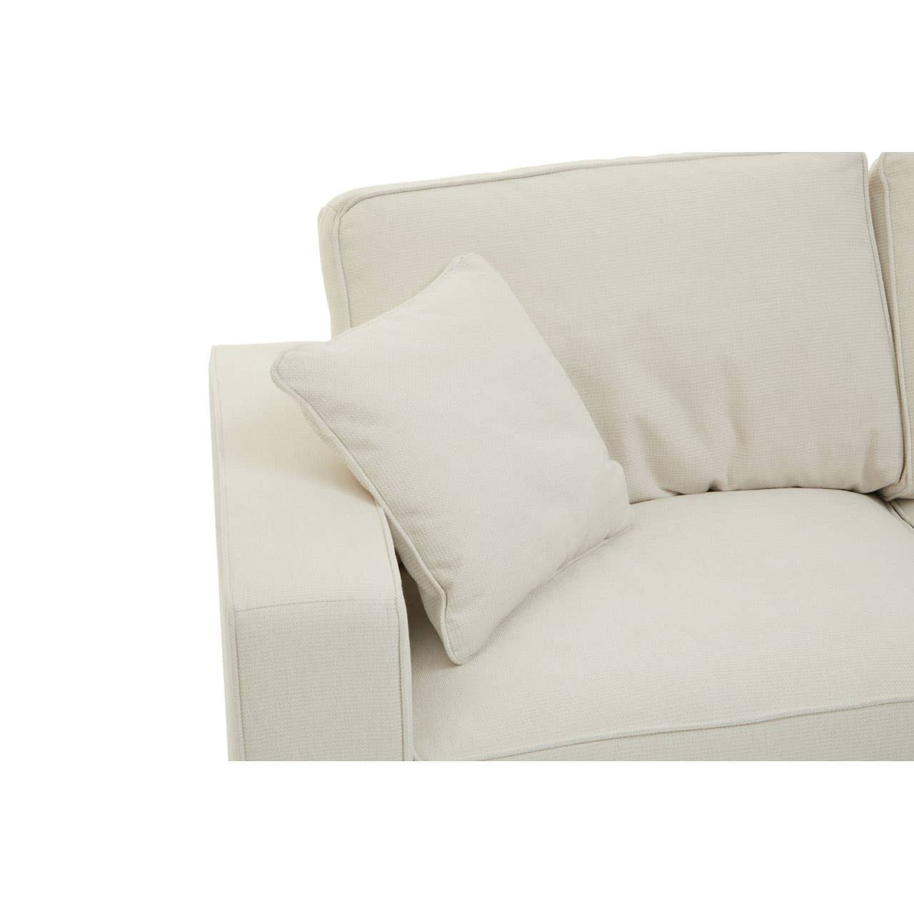 Cream fabric sofa with a rounded armrest and a plush back cushion, featuring a small decorative pillow on the seat. The fabric has a soft texture, and the overall design is modern and minimalist