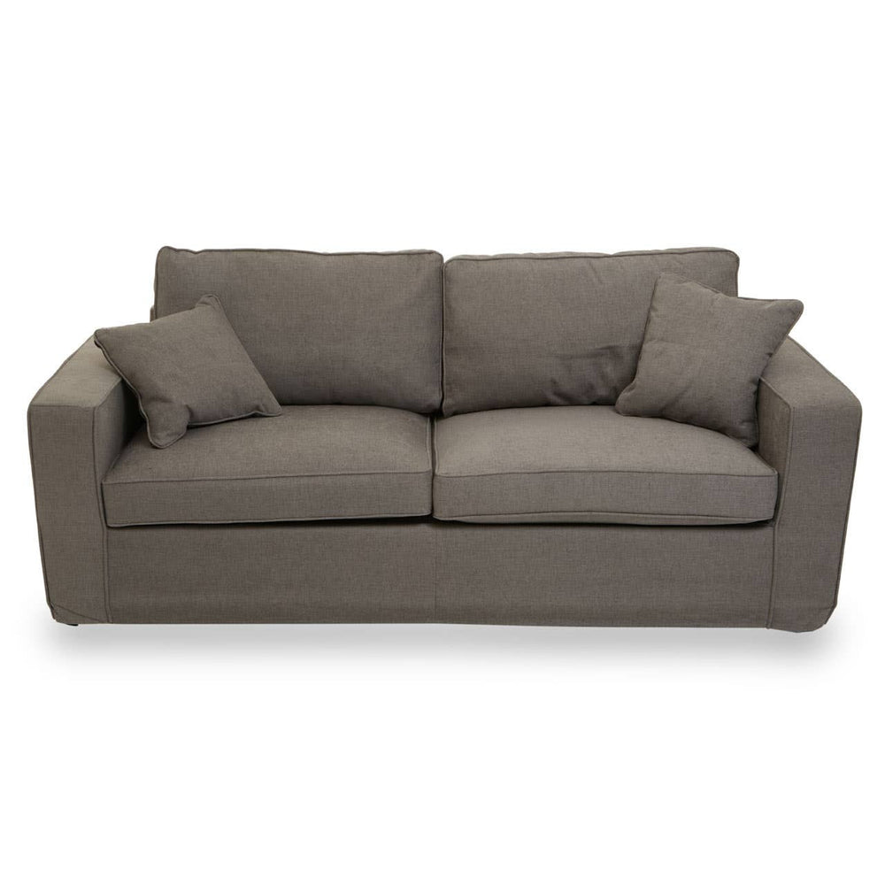 Three-seat sofa upholstered in grey fabric, featuring two large back cushions and two smaller accent pillows, with a modern, boxy design and sturdy armrests